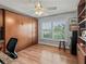 Bright bedroom/office with a built-in Murphy bed and storage cabinets at 591 Allenwood Loop, The Villages, FL 32162