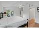 Spacious bedroom with dark wood furniture and hardwood floors at 591 Allenwood Loop, The Villages, FL 32162
