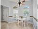 Cozy breakfast nook with tile flooring, a ceiling fan, and charming windows with plantation shutters at 591 Allenwood Loop, The Villages, FL 32162