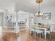 Open concept floor plan showcases a combined dining room, kitchen and breakfast bar at 591 Allenwood Loop, The Villages, FL 32162