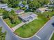 Aerial view of the home with property lines, metal roof, carport, and manicured lawn in a peaceful neighborhood at 601 Jason Dr, The Villages, FL 32159