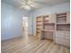 Bedroom with neutral walls and built in cabinets and office space at 601 Jason Dr, The Villages, FL 32159