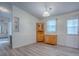 Dining room with wood-look flooring, beadboard and open doorway at 601 Jason Dr, The Villages, FL 32159
