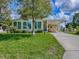 Charming home with a well-manicured lawn, carport, and ample parking space at 601 Jason Dr, The Villages, FL 32159
