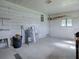 Garage space with sink, water heater, and ample storage at 601 Jason Dr, The Villages, FL 32159