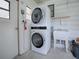 Convenient laundry room with stacked washer and dryer at 601 Jason Dr, The Villages, FL 32159