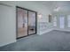 Spacious living area featuring built-in shelves, fan, and ample lighting at 601 Jason Dr, The Villages, FL 32159