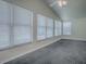 Large living room with bright natural light coming through the many windows at 601 Jason Dr, The Villages, FL 32159