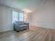 Cozy living room featuring a comfortable sofa, a lamp, and neutral-toned walls at 601 Jason Dr, The Villages, FL 32159