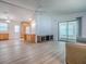 Open concept living space with sliding doors, wooden cabinets, and neutral walls at 601 Jason Dr, The Villages, FL 32159