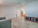 Open concept living space with neutral walls, wood-look flooring and living room furniture at 601 Jason Dr, The Villages, FL 32159
