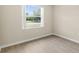 This bedroom features laminate flooring and a large window at 6640 Sw 85Th Pl, Ocala, FL 34476