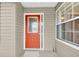 Inviting front door with decorative glass window and sidelight, framed by neutral siding at 6640 Sw 85Th Pl, Ocala, FL 34476