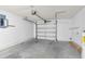 The garage features a gray concrete floor, an electrical panel, and a water heater at 6640 Sw 85Th Pl, Ocala, FL 34476