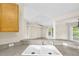Kitchen sink with views into the living room and sliding glass doors to the outside at 6640 Sw 85Th Pl, Ocala, FL 34476