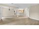 Spacious living area with wood floors and a view into the kitchen, great for entertaining at 6640 Sw 85Th Pl, Ocala, FL 34476