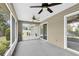 The screened patio boasts two ceiling fans and outdoor views, enhancing the home's appeal at 6640 Sw 85Th Pl, Ocala, FL 34476