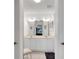 Bright bathroom with double vanity, white cabinets, and a clean, modern aesthetic at 670 Fayette Ct, The Villages, FL 32162