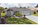 Well-maintained home featuring lovely landscaping and a two-car garage at 670 Fayette Ct, The Villages, FL 32162