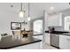 Bright kitchen featuring a center island, stainless steel appliances, and stylish pendant lighting at 670 Fayette Ct, The Villages, FL 32162