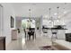 Open-concept floor plan with tiled floors and an adjacent dining area at 670 Fayette Ct, The Villages, FL 32162