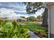 Neighborhood street view featuring beautiful landscaping and well-maintained homes at 670 Fayette Ct, The Villages, FL 32162
