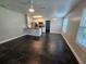 Open-concept living area featuring sleek tile flooring and modern lighting at 711 Sugar Bay Way # 115, Lake Mary, FL 32746