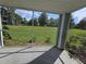 Relaxing screened patio featuring green lawn views at 711 Sugar Bay Way # 115, Lake Mary, FL 32746