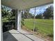 Screened-in porch with views of the landscaped yard and surrounding community at 711 Sugar Bay Way # 115, Lake Mary, FL 32746