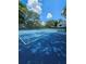Community tennis court surrounded by mature trees at 711 Sugar Bay Way # 115, Lake Mary, FL 32746