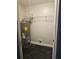 Utility room with water heater and shelving at 711 Sugar Bay Way # 115, Lake Mary, FL 32746