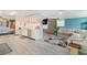 Open floor plan seamlessly blends kitchen and living areas, creating a cohesive and inviting space at 717 W Coach N Four Dr, Leesburg, FL 34748