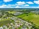 Aerial view of the home showcasing its location near a community green space and neighborhood at 804 Santa Rita Way, Lady Lake, FL 32159