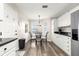 Bright dining area in the kitchen with natural light and convenient access to appliances at 804 Santa Rita Way, Lady Lake, FL 32159