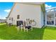 The home's exterior showcases a central AC unit, with well-maintained landscaping, and an enclosed porch at 804 Santa Rita Way, Lady Lake, FL 32159