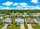 Charming home with a well-manicured lawn, outlined in red, surrounded by mature trees in a friendly neighborhood at 804 Santa Rita Way, Lady Lake, FL 32159