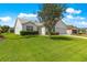 Well-kept lawn and landscaping complement this charming single-story home with an attached two-car garage at 804 Santa Rita Way, Lady Lake, FL 32159