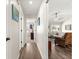 Hallway with views of the living room and guest bedroom with modern flooring at 804 Santa Rita Way, Lady Lake, FL 32159