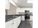Well-lit kitchen featuring stainless steel appliances, granite counters, and ample cabinet space at 804 Santa Rita Way, Lady Lake, FL 32159