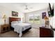 Cozy main bedroom featuring a bed, side tables, dresser, and a ceiling fan at 804 Santa Rita Way, Lady Lake, FL 32159