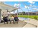 Enclosed patio has a hot tub, furniture, and ceiling fan for comfortable outdoor living at 804 Santa Rita Way, Lady Lake, FL 32159