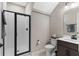 Bathroom features modern toilet, cabinets, and glass enclosed shower at 872 Griffon Ave, Lake Alfred, FL 33850