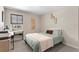 Bedroom with a desk setup, a large window, and soft colors at 872 Griffon Ave, Lake Alfred, FL 33850