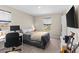 Bedroom with work desk, window, neutral colors and carpet at 872 Griffon Ave, Lake Alfred, FL 33850