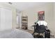Relaxing bedroom with a work desk, neutral colors, and carpet at 872 Griffon Ave, Lake Alfred, FL 33850