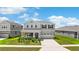 Beautiful two-story home with a well-manicured lawn and an attached two-car garage at 872 Griffon Ave, Lake Alfred, FL 33850