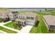 Two-story home with well-manicured lawn, stone accents, and a two car garage in a desirable neighborhood at 872 Griffon Ave, Lake Alfred, FL 33850
