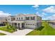 Charming two-story home featuring a two-car garage and a beautifully landscaped front yard at 872 Griffon Ave, Lake Alfred, FL 33850
