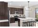 Well-equipped kitchen featuring stainless steel appliances, a large island, and modern lighting at 872 Griffon Ave, Lake Alfred, FL 33850