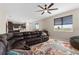 Cozy living area open to the kitchen, featuring a sectional sofa and decorative rug at 872 Griffon Ave, Lake Alfred, FL 33850